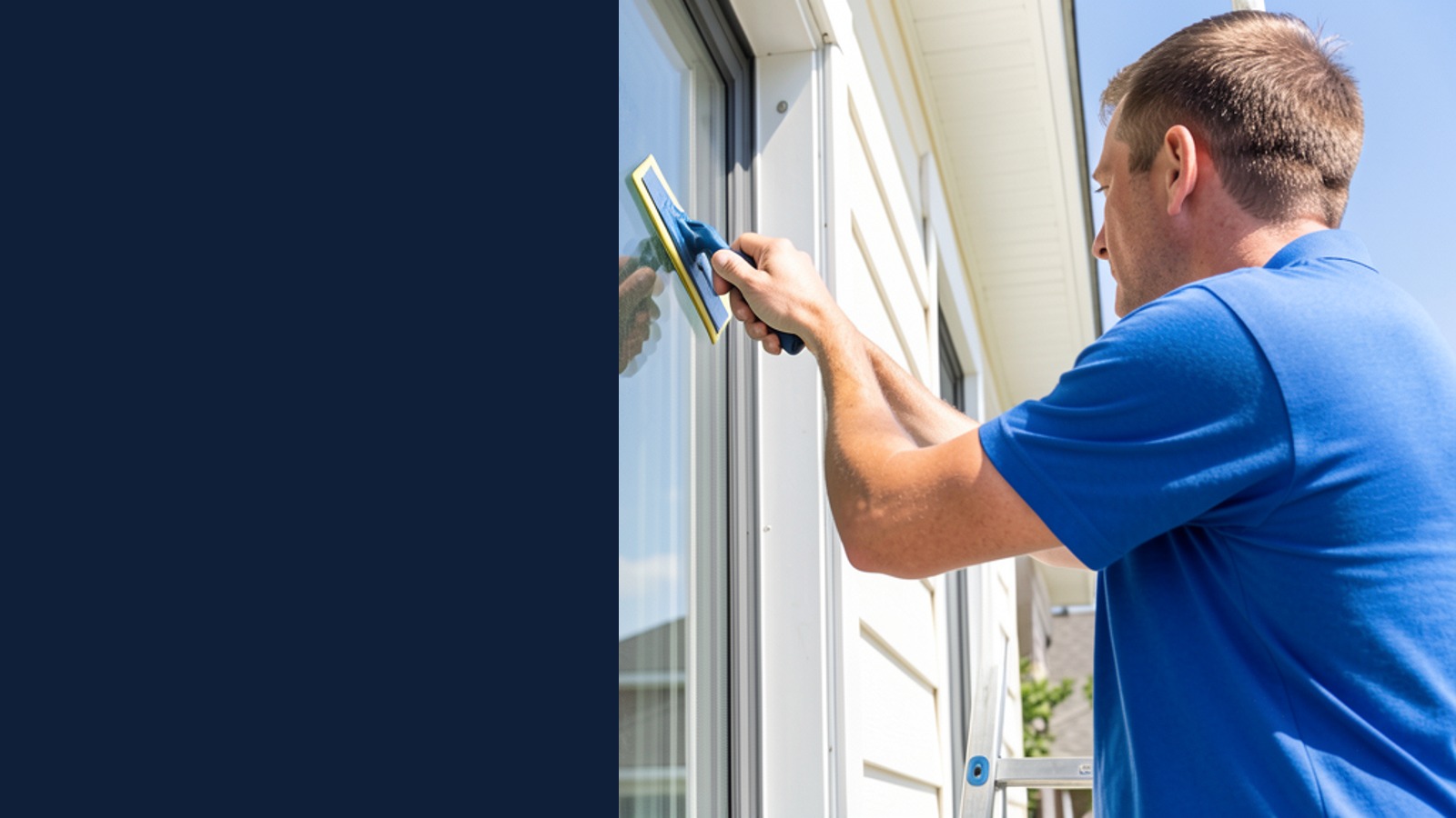 A window cleaner using a squeegee on a home window